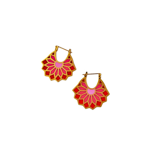 Pair of red and gold floral earrings on a white background