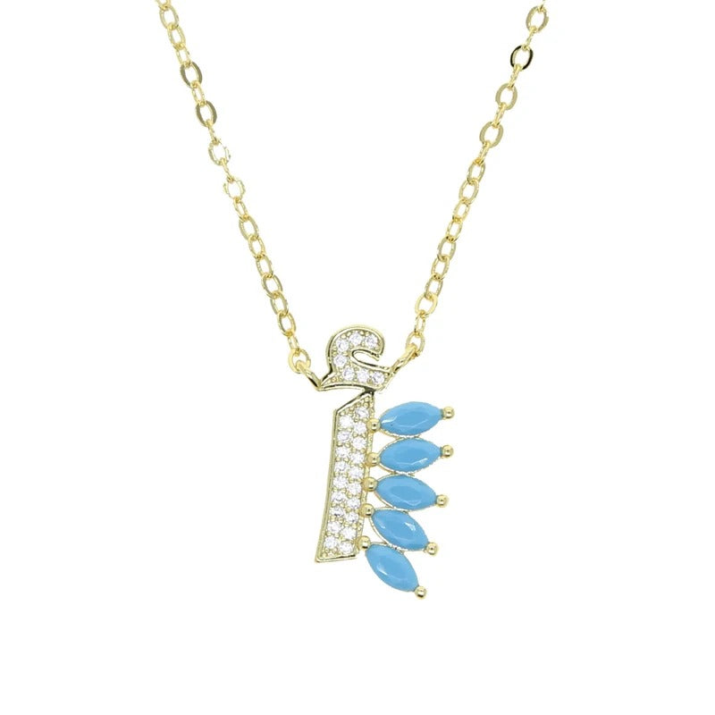 Golden Arabic letter Alef necklace with blue stones | عقد حرف ألف عربي ذهبي مع أحجار زرقاء

