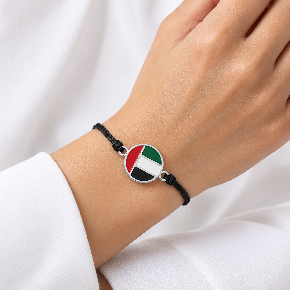UAE flag black cord bracelet — silver finish, woman — generated product styling