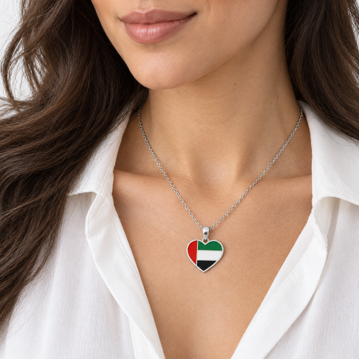 UAE flag heart necklace — silver finish, woman — generated styling image