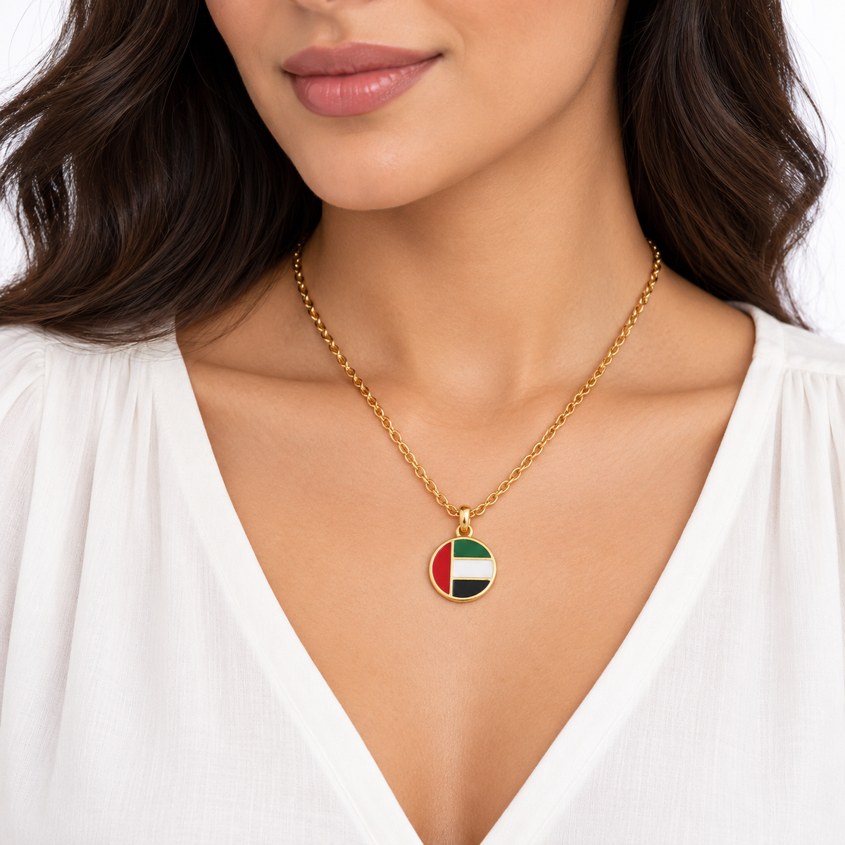 Round UAE flag necklace — gold finish, woman — generated product styling