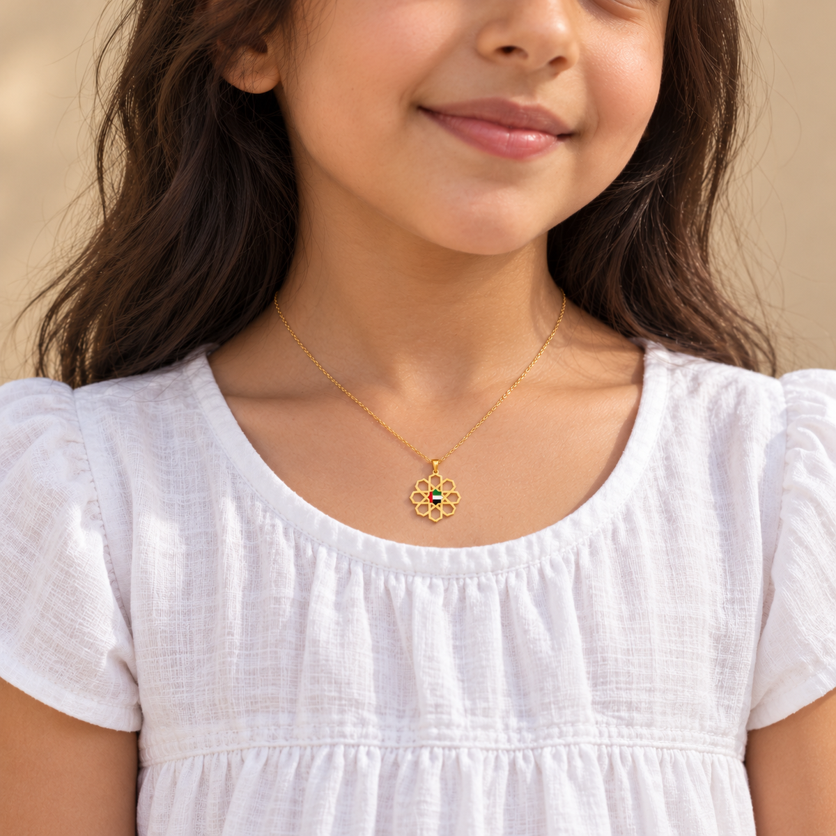 Child wearing delicate 1.5 cm UAE Arabesque Star necklace in gold plated finish — generated styling image