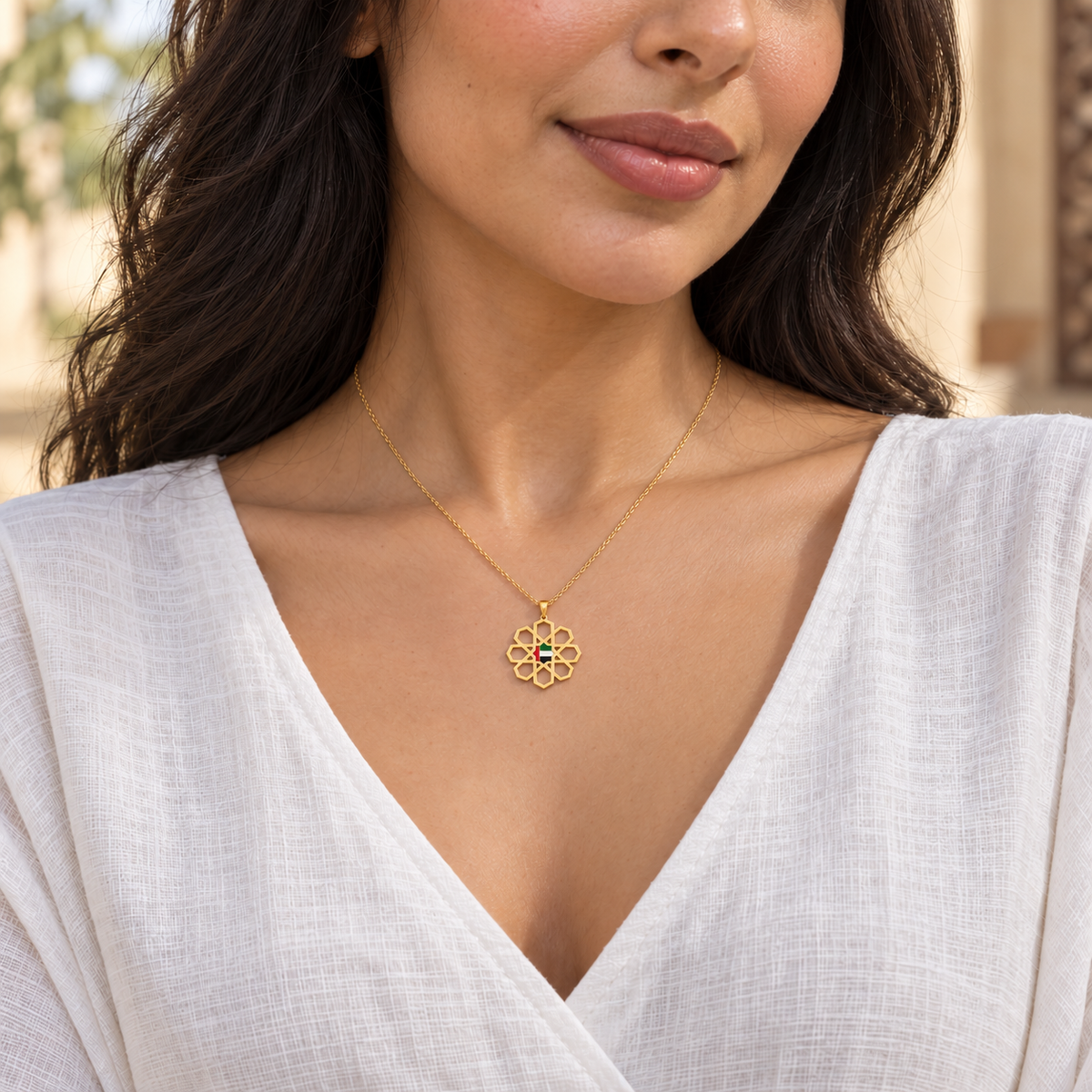 Woman wearing delicate 2 cm UAE Arabesque Star necklace in gold plated finish — generated styling image